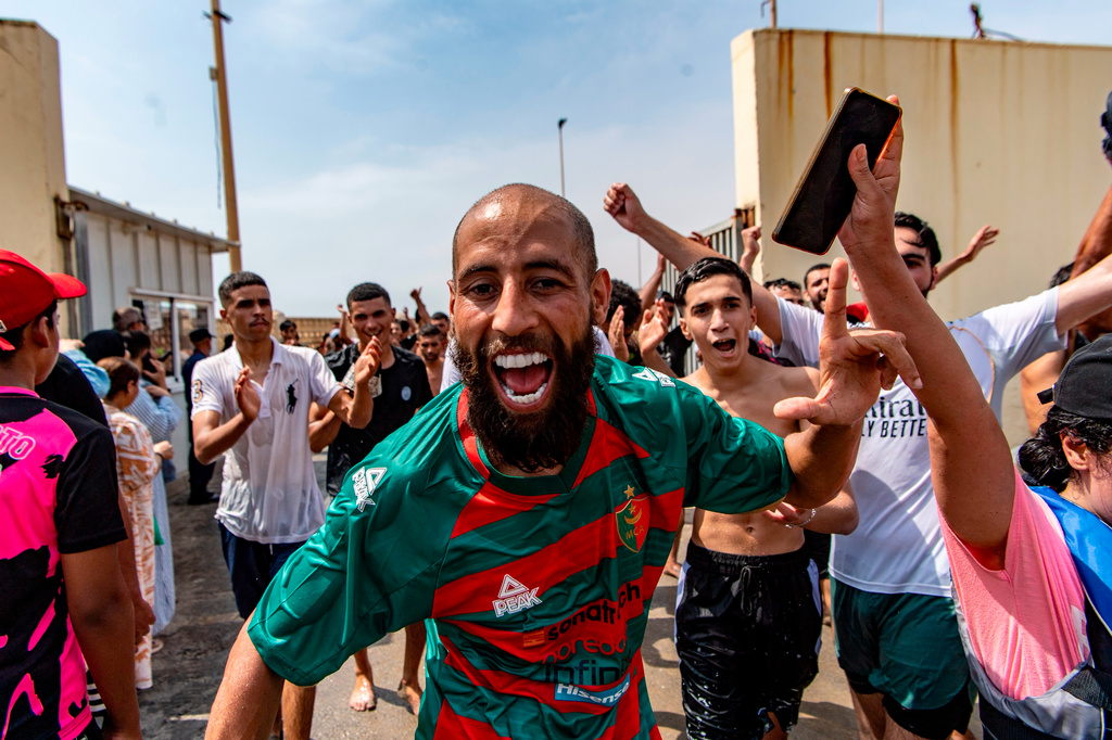 Migrants cross from Morocco into the Spanish enclave of Ceuta, Thursday, July 30, 2026. (AP Photo/Antonio Sempere)