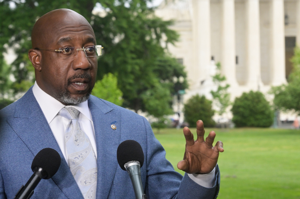 Sen. Raphael Warnock, D-Ga., holds a news conference regarding the Supreme Court Voting Rights decision on Capitol Hill, Wednesday, April 29, 2026, in Washington. (AP Photo/Rod Lamkey Jr.)