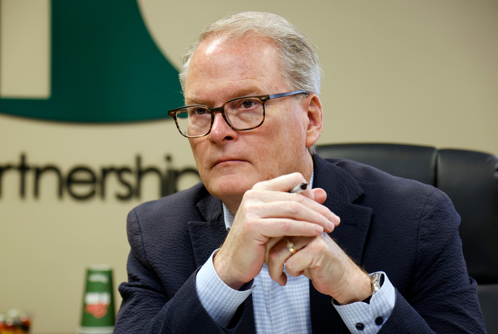 FILE - Democratic U.S. senatorial candidate Adam Hamilton of Kansas, listens to administrators at the Health Partnership Clinic as they discuss funding issues the low-income family medical facility is facing on Wednesday, Aug. 12, 2026, in Olathe. Kan. (AP Photo/Colin E. Braley, File)
