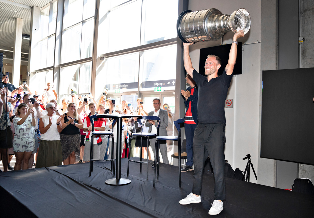 Carolina Hurricanes' Nikolaj Ehlers, of Denmark, presents Stanley Cup NHL hockey trophy at Sparekassen Danmark Arena in Aalborg, Denmark, Thursday, July 23, 2026. (Henning Bagger/Ritzau Scanpix via AP)