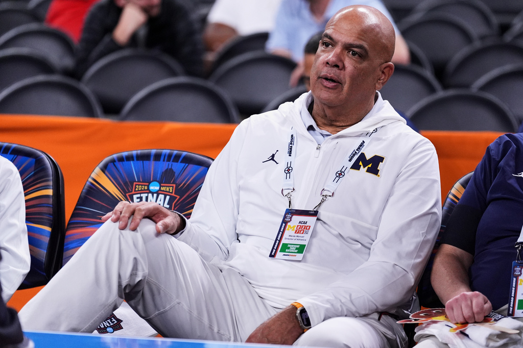 FILE - Michigan athletic director Warde Manuel watches Michigan practice ahead of an NCAA college basketball tournament semifinal game against Arizona at the Final Four, April 3, 2026, in Indianapolis. (AP Photo/Michael Conroy, File)