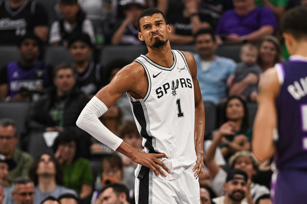 San Antonio Spurs forward Victor Wembanyama (1) reacts during the first half of an NBA basketball game against the Sacramento Kings, Tuesday, March 17, 2026, in Sacramento, Calif. (AP Photo/Justine Willard)
