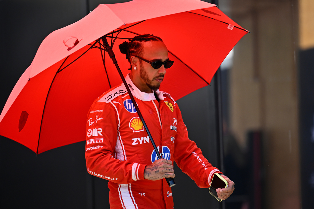 Ferrari driver Lewis Hamilton of Britain walks through the paddock ahead of the Austrian F1 Grand Prix, in Spielberg, Austria, Thursday, June 25, 2026. (AP Photo/Denes Erdos)