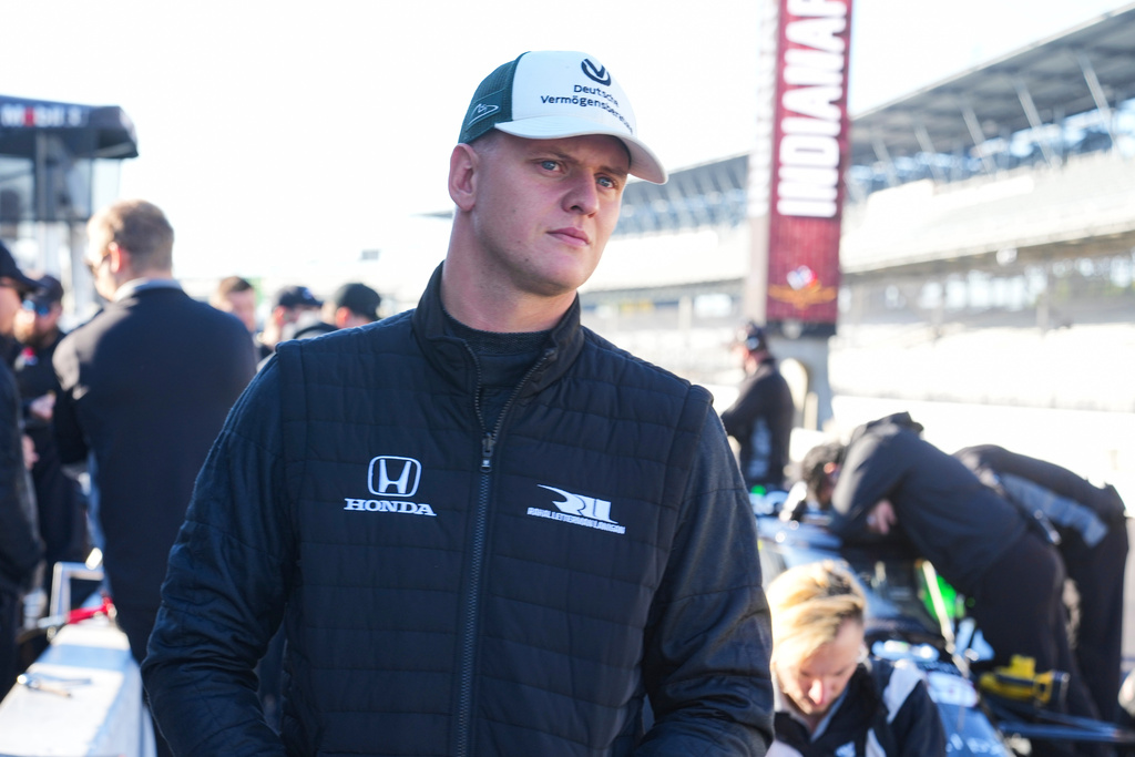 FILE - Race driver Mick Schumacher watches from the pit area as he participates in auto racing testing on the road coarse at Indianapolis Motor Speedway, Monday, Oct. 13, 2025, in Indianapolis. (AP Photo/Michael Conroy, File(