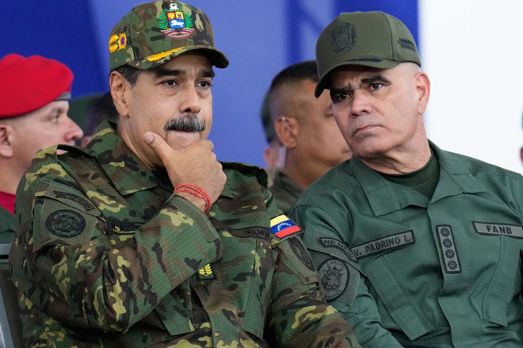 FILE - Venezuelan President Nicolas Maduro, left, and Defense Minister Vladimir Padrino Lopez attend a government-organized civic-military march in Caracas, Venezuela, Nov. 25, 2025. (AP Photo/Ariana Cubillos, File)