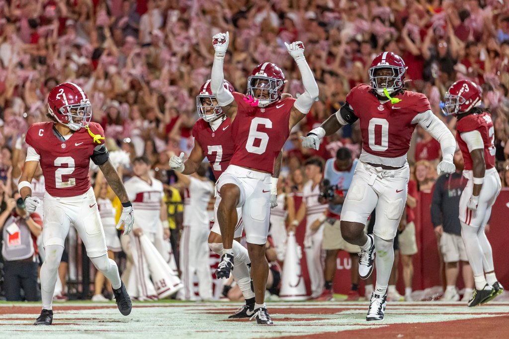 Alabama defensive back Red Morgan (6) celebrates after his interception return for a touchdown against South Carolina during the first half of an NCAA college football game Saturday, Sept. 26, 2026, in Tuscaloosa, Ala. (AP Photo/Vasha Hunt)