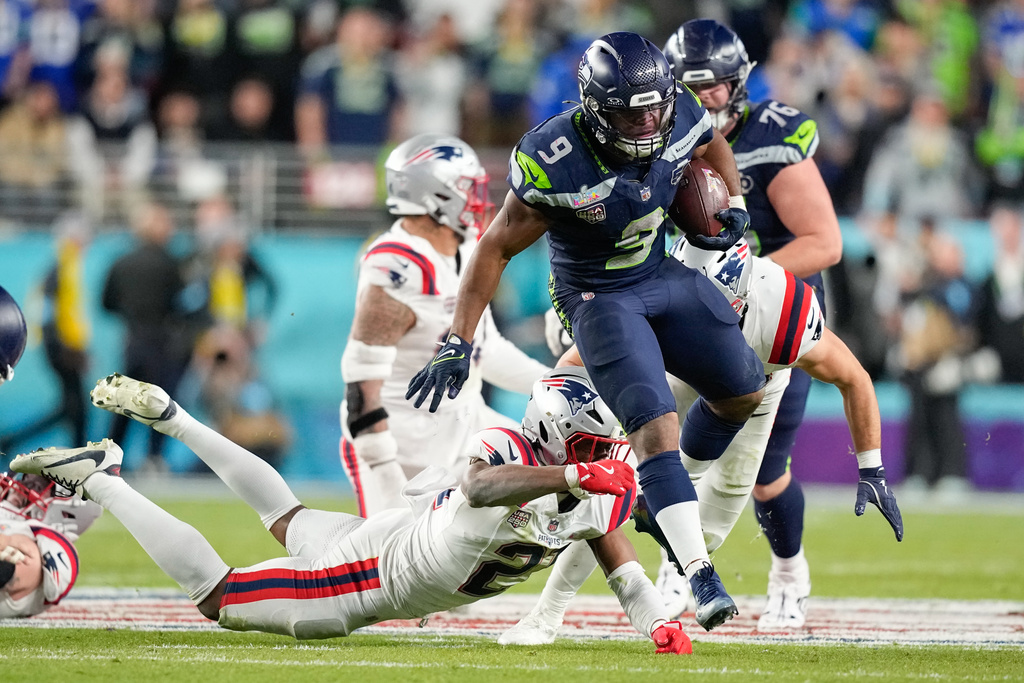 Seattle Seahawks running back Kenneth Walker III (9) leaps for yardage during the second half of the NFL Super Bowl 60 football game against the New England Patriots, Sunday, Feb. 8, 2026, in Santa Clara, Calif. (AP Photo/Julio Cortez)