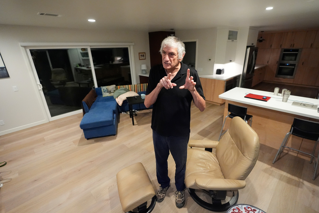 John Martinis stands in his living room after winning the Nobel Prize in Physics for his work on quantum tunneling on Tuesday, Oct. 7, 2025, in Santa Barbara, Calif. (AP Photo/Mark J. Terrill)