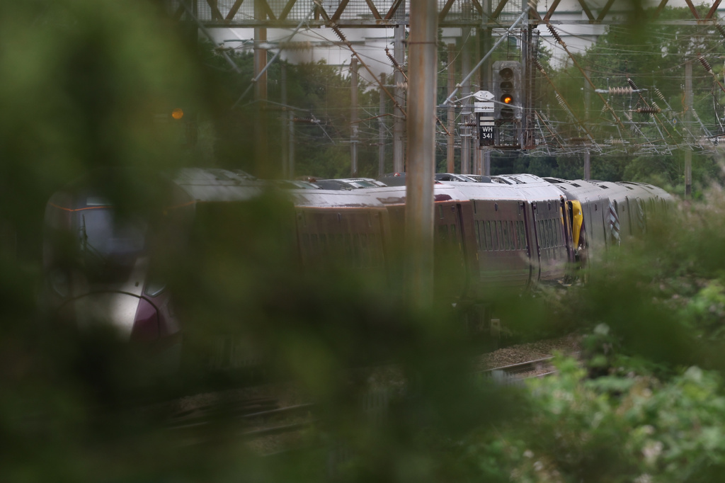 A train on the tracks outside Bedford, England, Saturday June 20, 2026, after two trains traveling south to London St. Pancras station collided outside the town of Bedford on Friday (Chris Radburn/PA via AP)