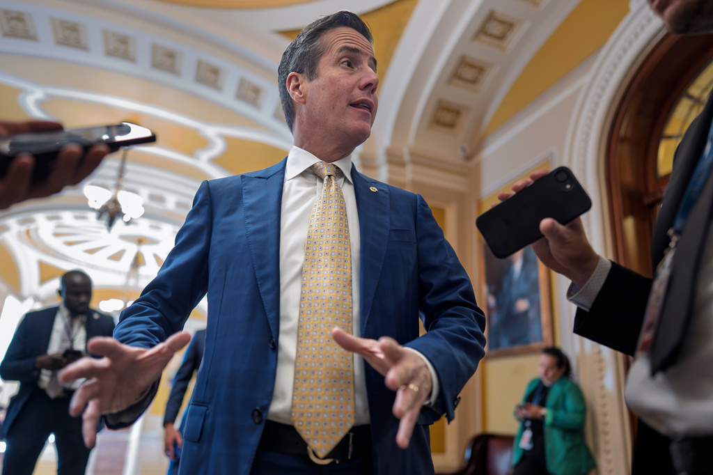 Sen. Bernie Moreno, R-Ohio, talks to reporters outside the chamber at the Capitol in Washington, Wednesday, Sept. 30, 2026. (AP Photo/J. Scott Applewhite)