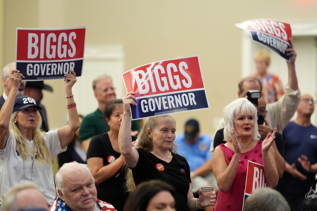Supporters of Rep. Andy Biggs, R-Ariz., who is running in the primary for Arizona governor, listen to speakers at a campaign event, Friday, July 17, 2026, in Gilbert, Ariz. (AP Photo/Ross D. Franklin)