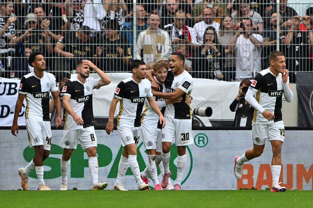 Elversberg's Cole Campbell, third from right, celebrates with teammates after scoring during a Bundesliga soccer match between Elversberg and Bayer Leverkusen, in Spiesen-Elversberg, Germany, Saturday, Aug. 29, 2026. (Harald Tittel/dpa via AP)