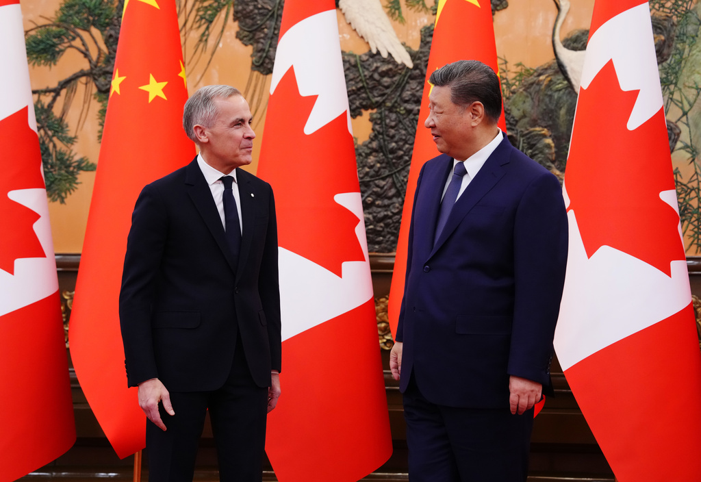 FILE - Canada's Prime Minister Mark Carney, left, meets with Chinese President Xi Jinping at the Great Hall of the People in Beijing Friday, Jan. 16, 2026. (Sean Kilpatrick/The Canadian Press via AP, File)