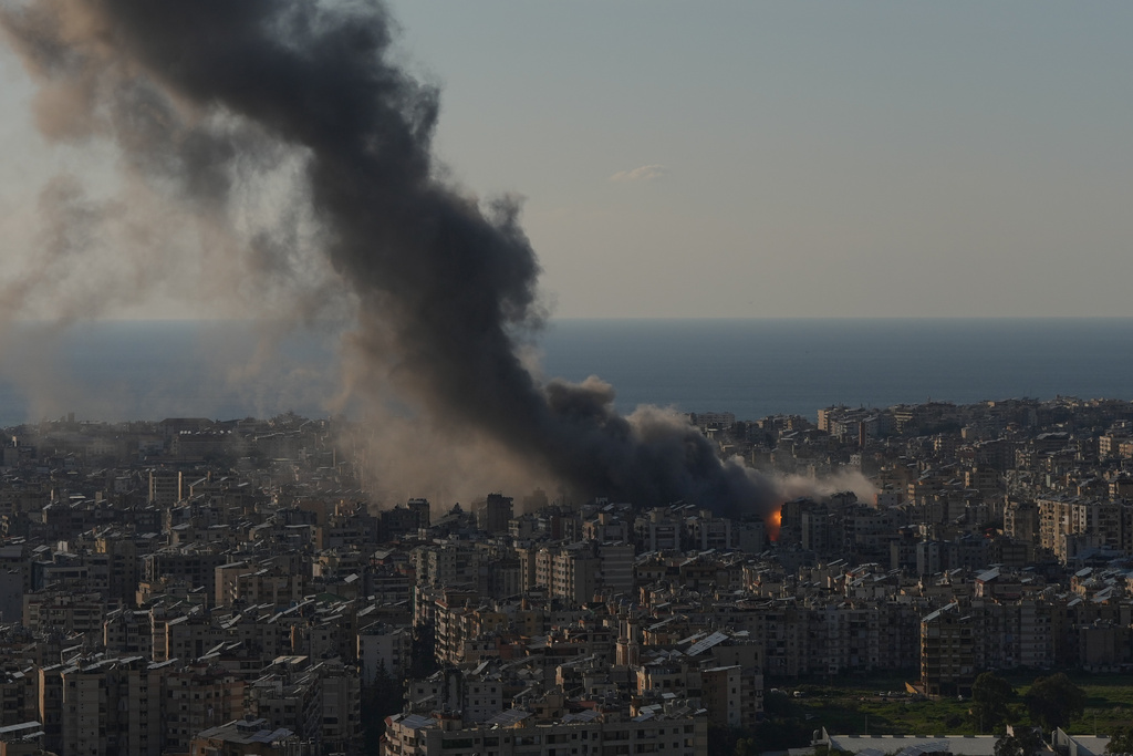 Flames and smoke rise from Israeli airstrikes on Dahiyeh, a southern suburb of Beirut, Lebanon, Monday, March 2, 2026. (AP Photo/Hassan Ammar)