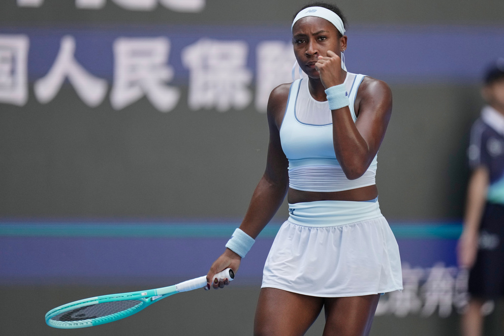 Coco Gauff of the United States reacts after scoring a point against Belinda Bencic of Switzerland during a women's singles match of the China Open tennis tournament, in Beijing, China, Tuesday, Sept. 30, 2025. (AP Photo/Mahesh Kumar A.)