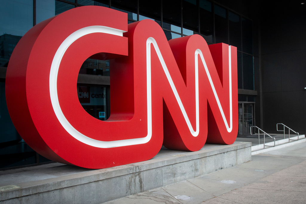 FILE - The CNN logo is displayed at the entrance to the CNN Center in Atlanta on Feb. 2, 2022. (AP Photo/Ron Harris, File)