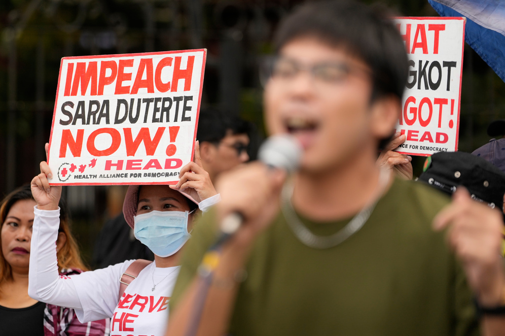 Protesters shout slogans as they hold a rally outside the House of Representatives while a congressional hearing on an impeachment bid against Vice President Sara Duterte is ongoing in Quezon, Philippines, Wednesday, April 29, 2026. (AP Photo/Aaron Favila)