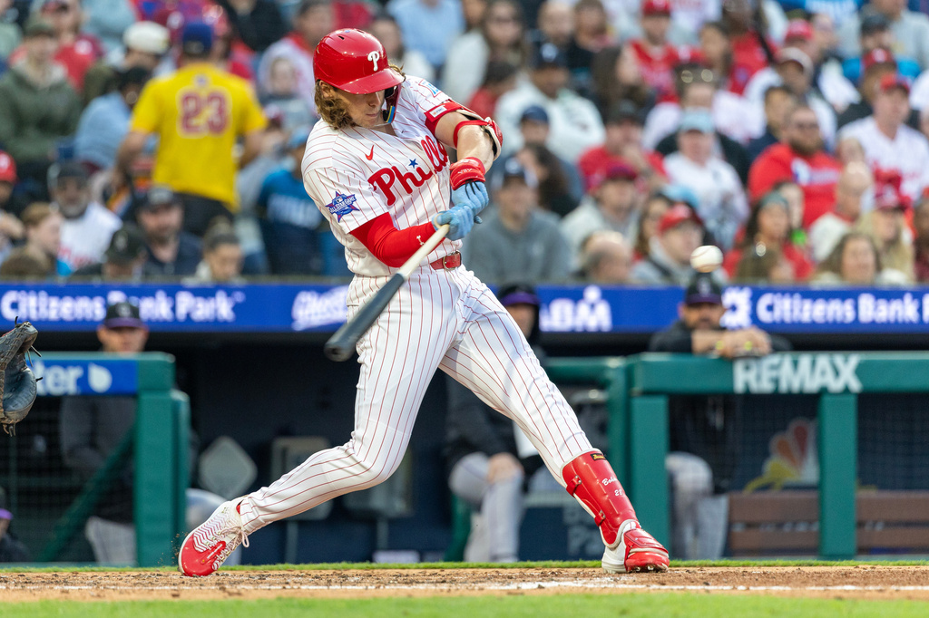 Philadelphia Phillies' Alec Bohm hits a solo home run during the third inning of a baseball game against the Colorado Rockies, Saturday, May 9, 2026, in Philadelphia. (AP Photo/Laurence Kesterson)
