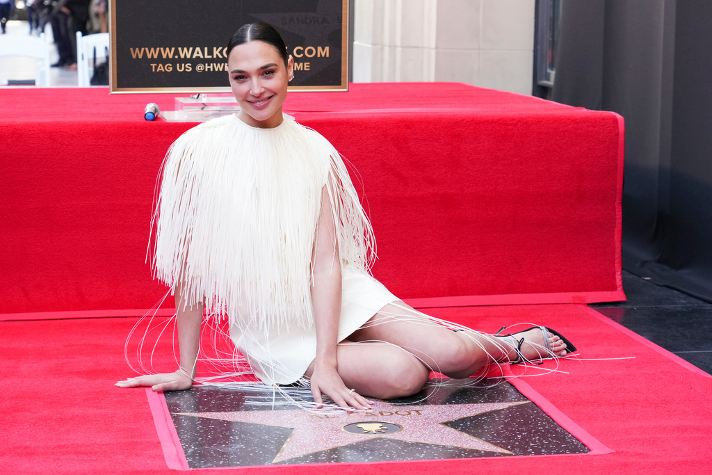 FILE - Gal Gadot poses with her new star at a ceremony honoring her on the Hollywood Walk of Fame on Tuesday, March 18, 2025, in Los Angeles. (Photo by Jordan Strauss/Invision/AP, file)