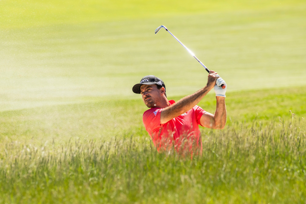 Nick Taylor, of Winnipeg, Manitoba, hits a shot out of the bunker during the second round of the RBC Canadian Open in Caledon, Ontario, on Friday, June 12, 2026. (Nick Iwanyshyn/The Canadian Press via AP)