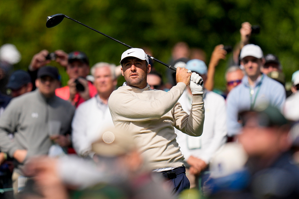 Scottie Scheffler watches his tee shot on the 17th hole during a practice round ahead of the Masters golf tournament at the Augusta National Golf Club, Wednesday, April 8, 2026, in Augusta, Ga. (AP Photo/Eric Gay)