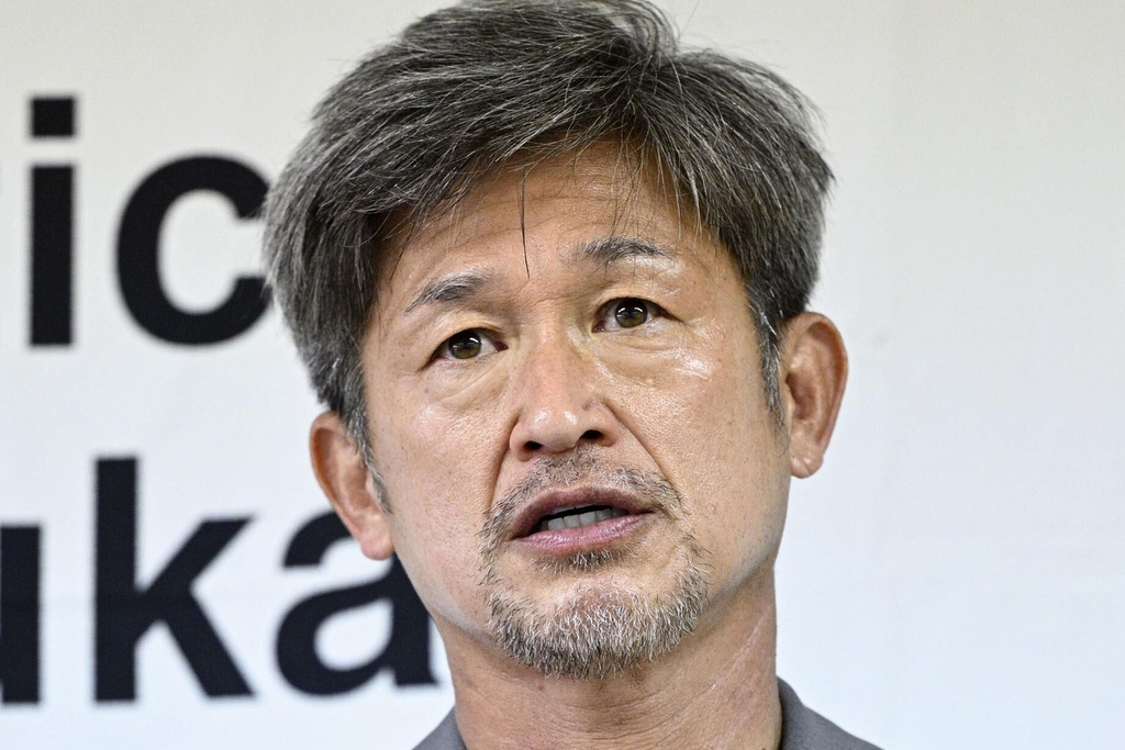 Japanese soccer player Kazuyoshi Miura speaks during a press conference in Suzuka, central Japan, on Nov. 30, 2025. (Kyodo News via AP)