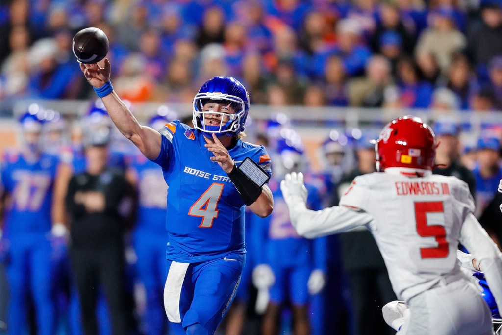 Boise State quarterback Maddux Madsen (4) throws a touchdown pass against New Mexico in the first half of an NCAA college football game, Saturday, Oct. 11, 2025, in Boise, Idaho. (AP Photo/Steve Conner)
