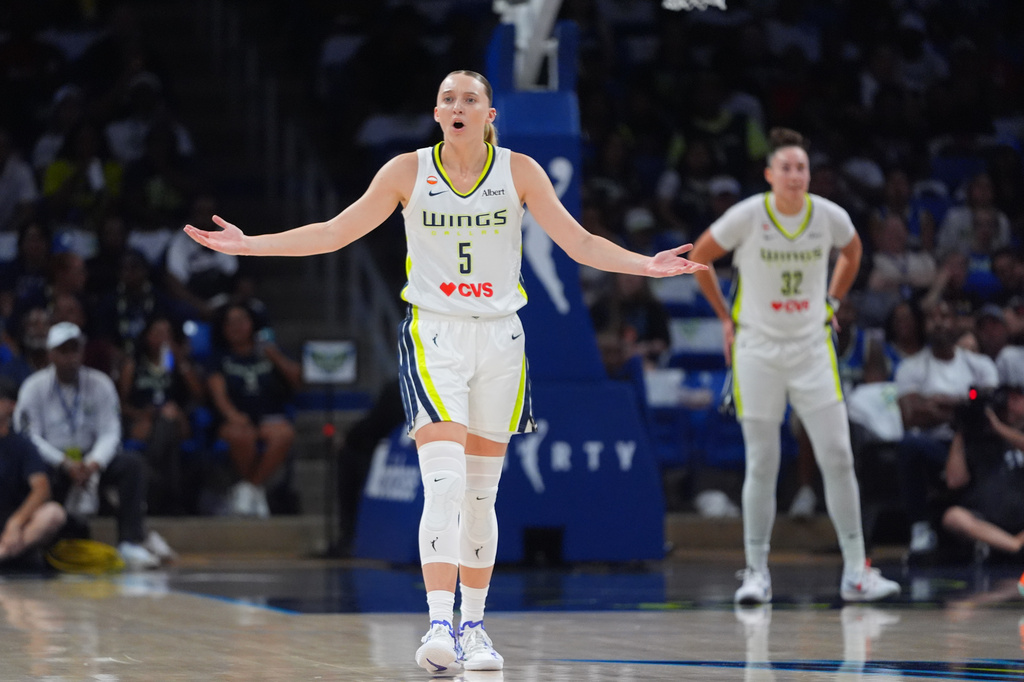 Dallas Wings guard Paige Bueckers questions a call during the first half of a WNBA basketball game against the Atlanta Dream in Arlington, Texas, Wednesday, July 29, 2026. (AP Photo/LM Otero)