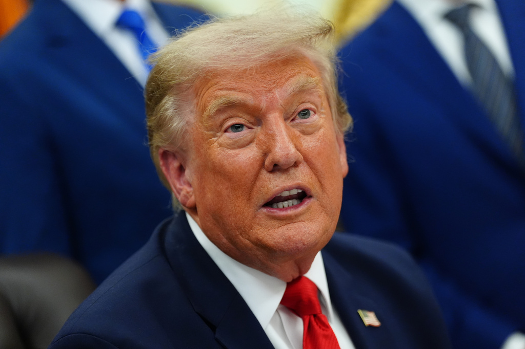 President Donald Trump speaks in the Oval Office of the White House about Dulles International Airport modernization, Wednesday, July 29, 2026, in Washington. (AP Photo/Julia Demaree Nikhinson)