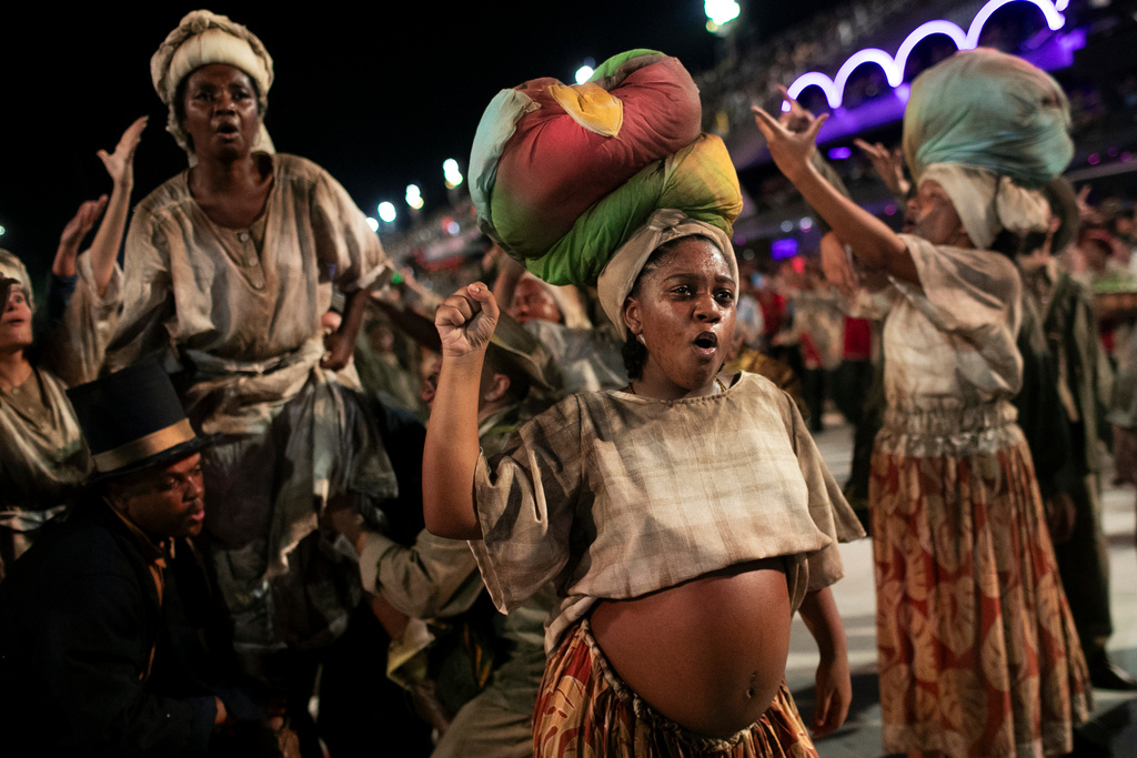 Performers from the Unidos da Tijuca samba school parade during Carnival celebrations at the Sambadrome in Rio de Janeiro, early Tuesday, Feb. 17, 2026. (AP Photo/Bruna Prado)