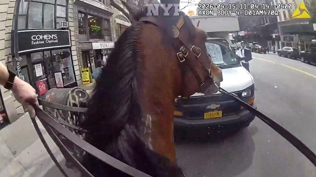 This image taken from NYPD Bodycam shows an NYPD police officer on horseback chasing an alleged purse theft on Wednesday, April 15, 2026 in New York. (NYPD via AP)