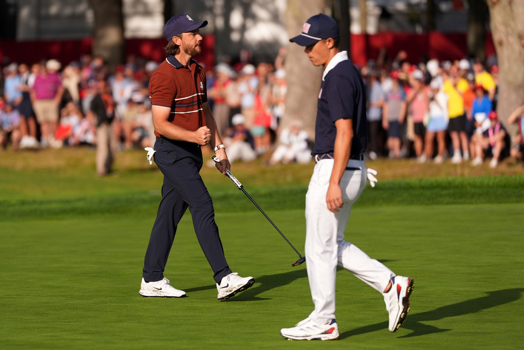 Europe's Tommy Fleetwood celebrates after a putt on the seventh hole at Bethpage Black golf course during the Ryder Cup golf tournament, Saturday, Sept. 27, 2025, in Farmingdale, N.Y. (AP Photo/Lindsey Wasson)
