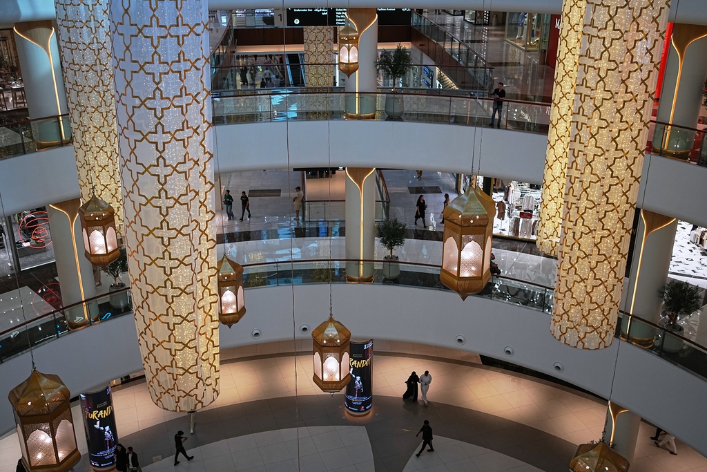 People walk inside Dubai Mall in Dubai, United Arab Emirates, Saturday, March 7, 2026. (AP Photo/ Fatima Shbair)