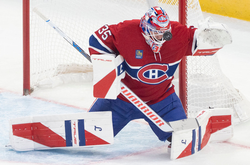 Montreal Canadiens goaltender Sam Montembeault (35) makes a save against the Seattle Kraken during the first period of an NHL hockey game in Montreal on Tuesday, Oct. 14, 2025. (Christinne Muschi/The Canadian Press via AP) Montreal Canadiens goaltender Sam Montembeault (35) makes a save against the Seattle Kraken during the first period of an NHL hockey game in Montreal on Tuesday, Oct. 14, 2025. (Christinne Muschi/The Canadian Press via AP)