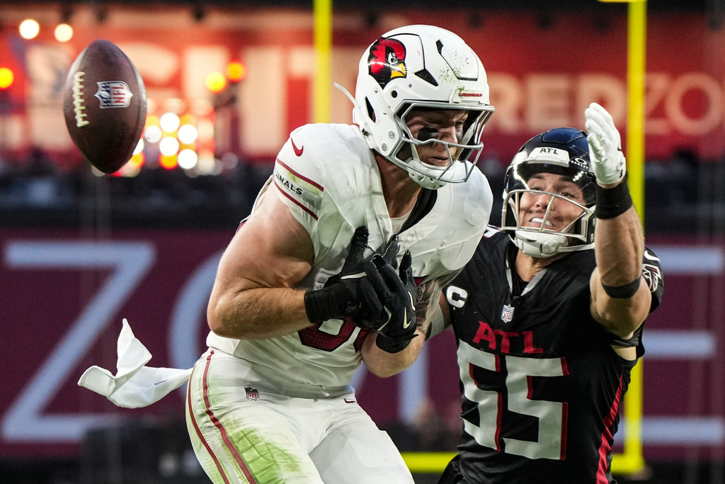 Atlanta Falcons linebacker Kaden Elliss (55) blocks a pass against Arizona Cardinals tight end Trey McBride (85) during the second half of an NFL football game, Sunday, Dec. 21, 2025, in Glendale, Ariz. (AP Photo/Rick Scuteri)