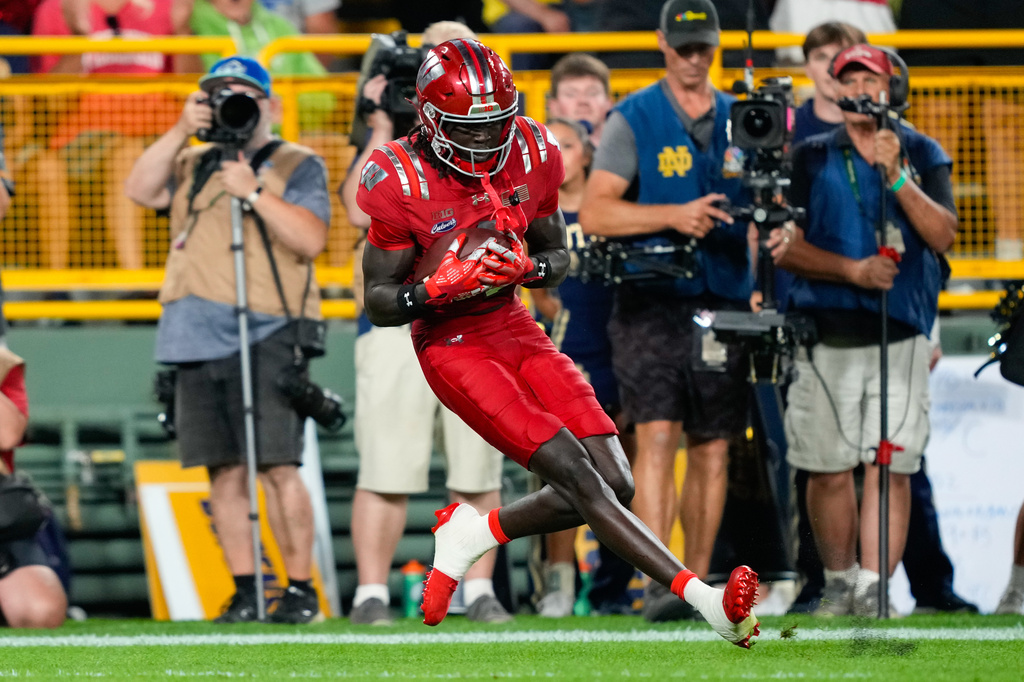 Wisconsin wide receiver Malachi Coleman catches a touchdown pass during the first half of an NCAA college football game against the Notre Dame Sunday, Sept. 6, 2026, in Green Bay, Wis. (AP Photo/Kayla Wolf)