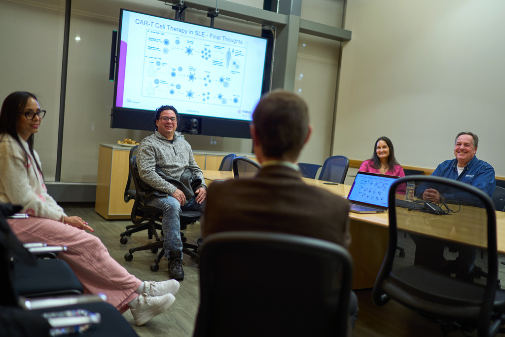 Ruth Wilson, left, attends a lupus support group with Dr. Roberto Caricchio, center, director of the Lupus Center at UMass Chan Medical School, and fellow lupus patients Juan Sanchez, from second left, Rekha Sredhara and Frank Camacho, Wednesday, Feb. 12, 2025, in Worcester, Mass. (AP Photo/David Goldman)