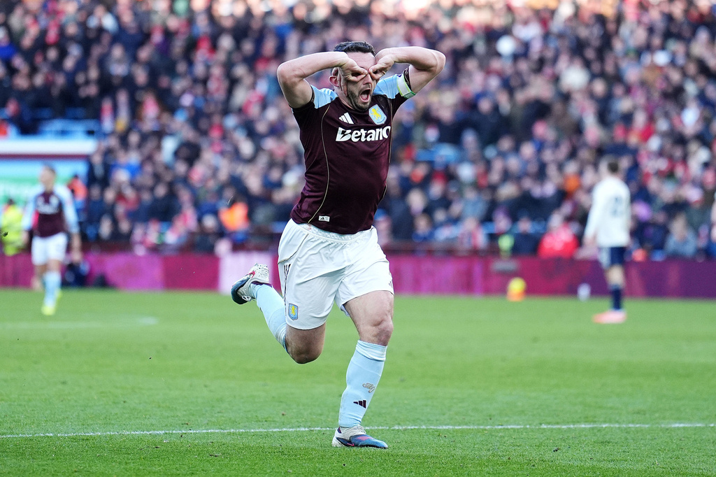 Aston Villa's John McGinn celebrates scoring their side's third goal during their English Premier League soccer match in Birmingham, England, Saturday, Jan. 3, 2026. (Martin Rickett/PA via AP)