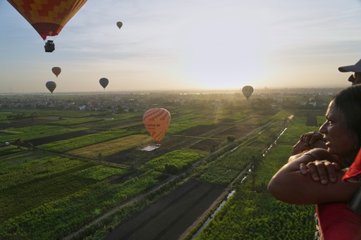 An Indian tourist views the city during their tour on a hot air balloon on the west bank of the Nile River in Luxor, Egypt, Oct. 4, 2025. (AP Photo/Amr Nabil) An Indian tourist views the city during their tour on a hot air balloon on the west bank of the Nile River in Luxor, Egypt, Oct. 4, 2025. (AP Photo/Amr Nabil)