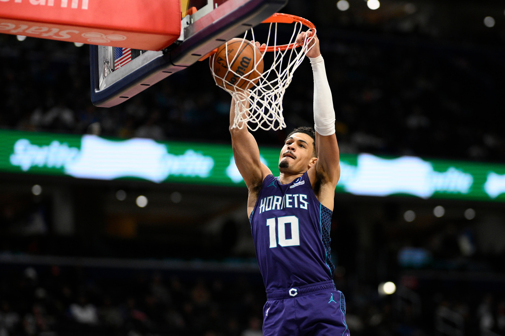 Charlotte Hornets guard Josh Green dunks during the first half of an NBA basketball game against the Washington Wizards, Sunday, Feb. 22, 2026, in Washington. (AP Photo/Nick Wass)