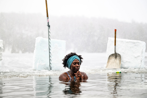 FILE - Canda-Leigh Habonimana dips in the waters of Gatineau Park's Meech Lake in Chelsea, Que., during a polar bear dip on New Year's Day, Jan. 1, 2025. (Justin Tang /The Canadian Press via AP) FILE - Canda-Leigh Habonimana dips in the waters of Gatineau Park's Meech Lake in Chelsea, Que., during a polar bear dip on New Year's Day, Jan. 1, 2025. (Justin Tang /The Canadian Press via AP)