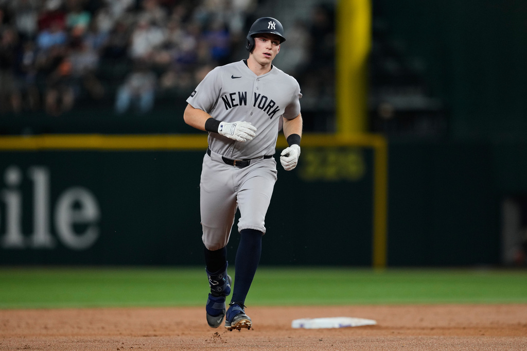 New York Yankees' Ben Rice rounds the bases after hitting a tw-run home run in the third inning of a baseball game against the Texas Rangers Monday, April 27, 2026, in Arlington, Texas. (AP Photo/Tony Gutierrez)