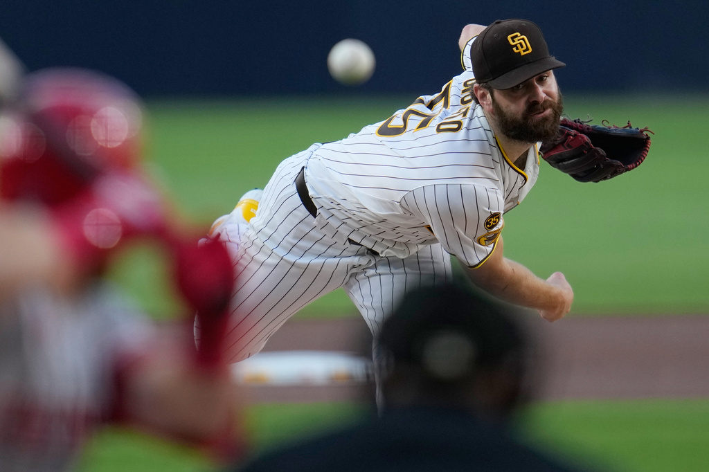 San Diego Padres starting pitcher Lucas Giolito works against a Cincinnati Reds batter during the first inning of a baseball game Tuesday, June 9, 2026, in San Diego. (AP Photo/Gregory Bull)