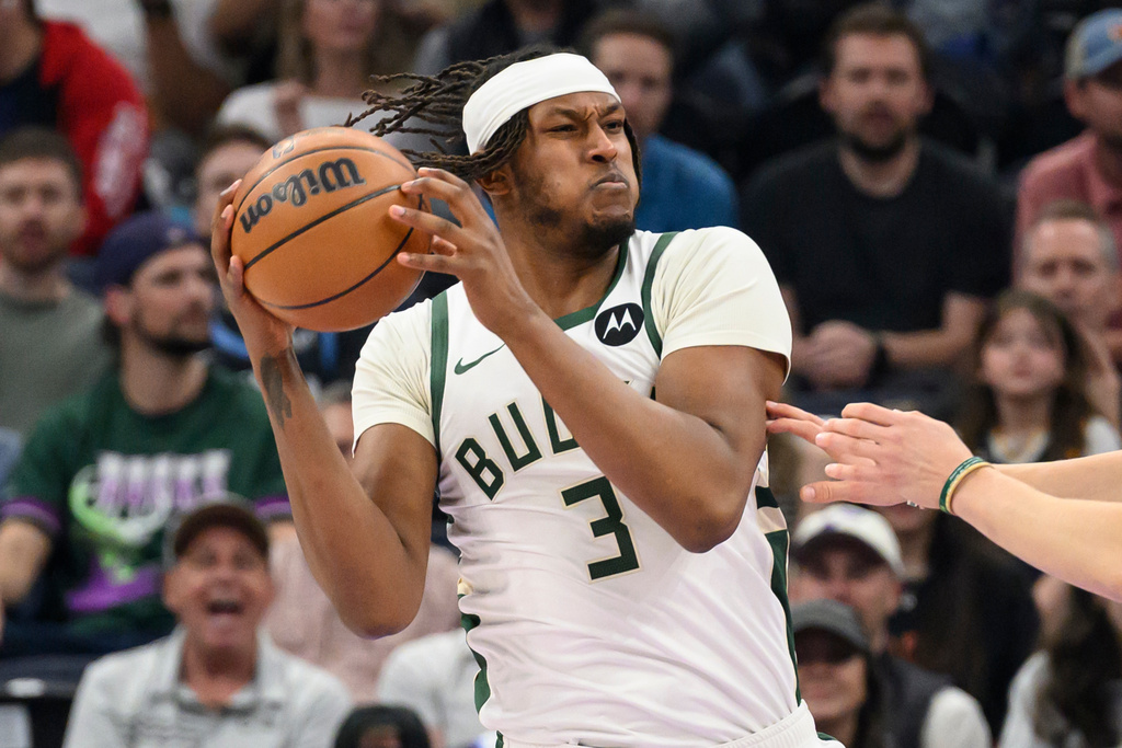 Milwaukee Bucks center Myles Turner secures the rebound during the first half of an NBA basketball game against the Utah Jazz, Thursday, March 19, 2026, in Salt Lake City. (AP Photo/Tyler Tate)