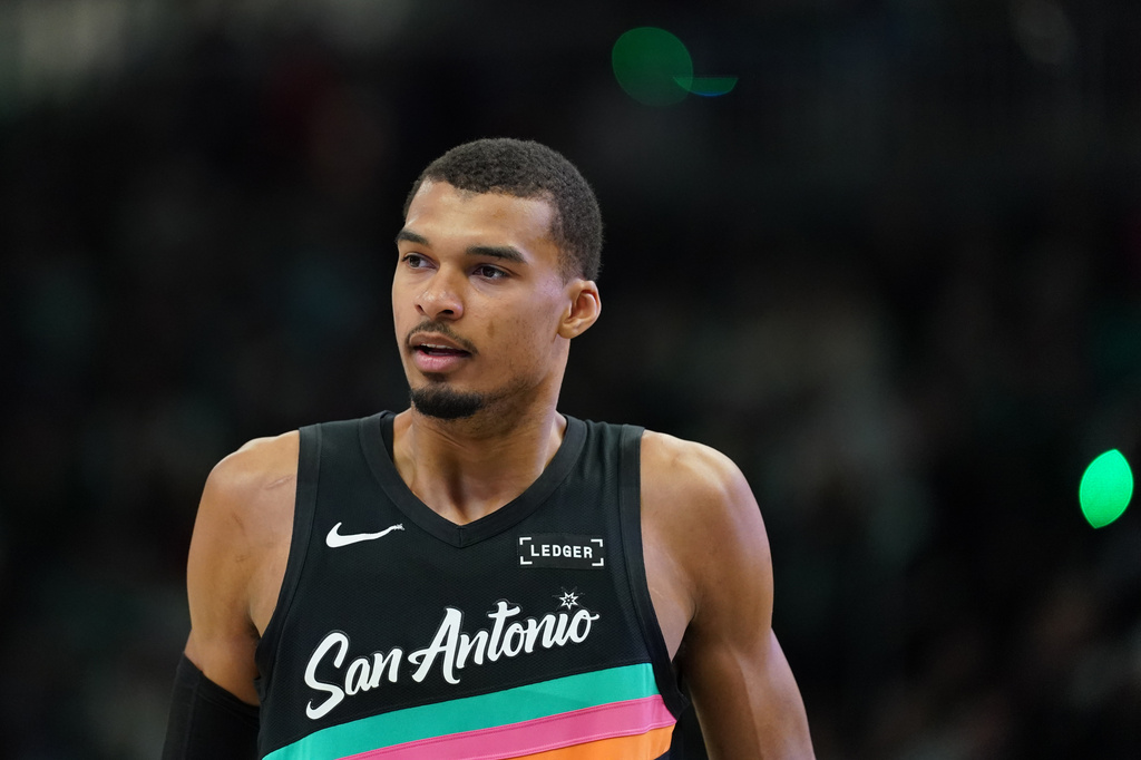San Antonio Spurs' Victor Wembanyama looks on during the first half of an NBA basketball game against the Milwaukee Bucks, Saturday, March 28, 2026, in Milwaukee. (AP Photo/Aaron Gash)
