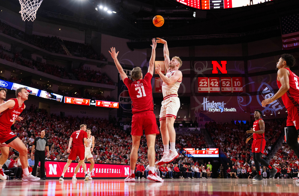 Nebraska's Rienk Mast, right, shoots against Wisconsin's Nolan Winter during the first half of an NCAA college basketball game Wednesday, Dec. 10, 2025, in Lincoln, Neb. (AP Photo/Rebecca S. Gratz)