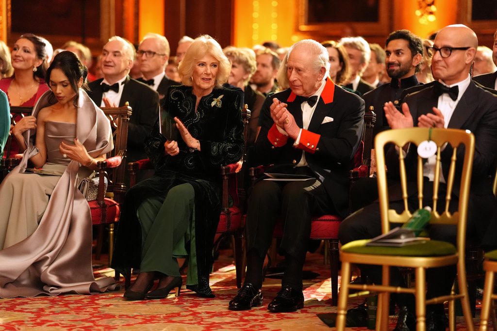Britain's King Charles III and Queen Camilla attend the premiere of Prime Video's Finding Harmony: A King's Vision, at Windsor Castle in Berkshire, England, Wednesday, Jan. 28, 2026. (Jonathan Brady/Pool Photo via AP)