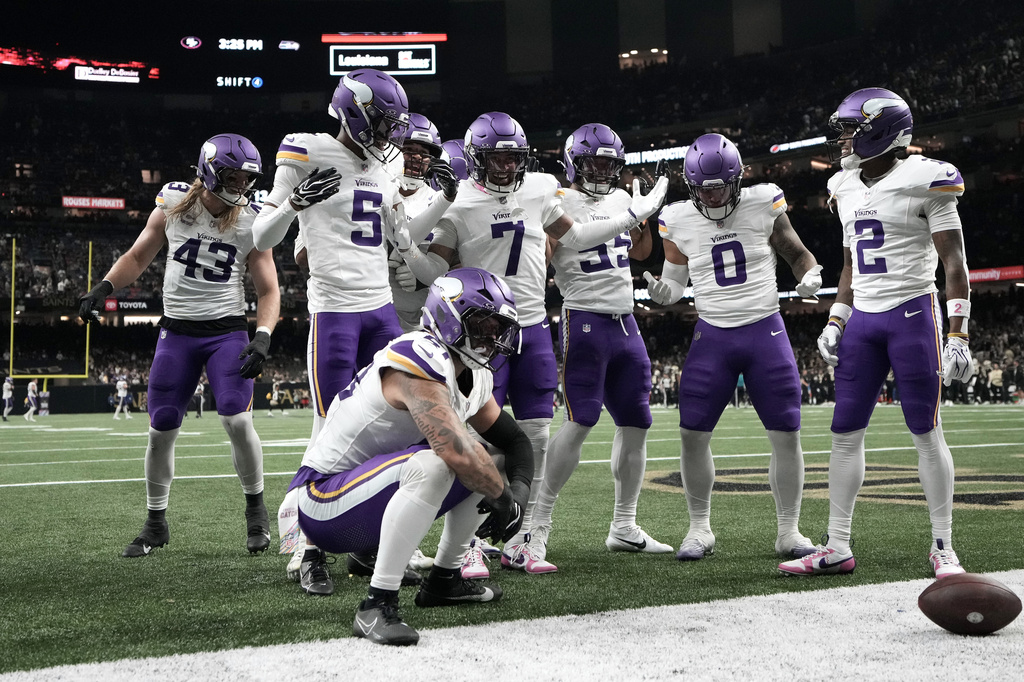 Minnesota Vikings cornerback Byron Murphy Jr. (7) celebrates with teammates after intercepting a pass against the New Orleans Saints during the second half of an NFL football game in New Orleans, Sunday, Oct. 11, 2026. (AP Photo/Matthew Hinton)