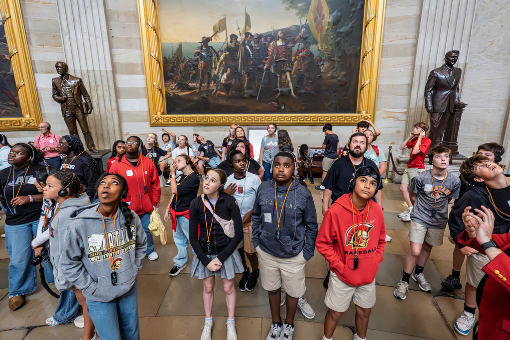 Visitors tour the Capitol Rotunda as the government lurches toward a shutdown at midnight if the Senate does not pass a House measure that would extend federal funding for seven weeks, at the Capitol in Washington, Tuesday, Sept. 30, 2025. (AP Photo/J. Scott Applewhite)