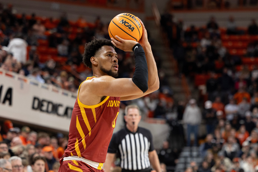 Iowa State forward Joshua Jefferson (5) shoots a three in the first half of the NCAA college basketball game against Oklahoma State, Saturday, Jan. 24, 2026 in Stillwater, Okla. (AP Photo/Mitch Alcala)